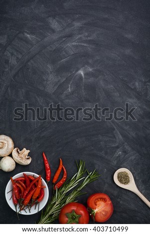 Restaurant black table with food ingredients and utensil, top view frame style