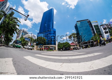 HO CHI MINH/ VIET NAM  - JUNE 28, 2015: Place across the road under Le Loi street, with tall buildings, under the lens fish eyes.