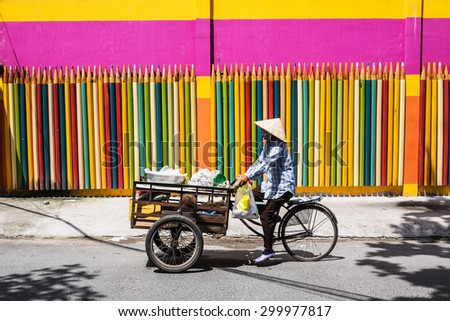 HO CHI MINH/ VIET NAM - JUNE 28, 2015: everyone is moving forward with a pencil fence colorful
