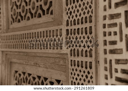 Detail of the elaborately carved lattices in the walls of the Isa bin Ali house in Muharraq, Bahrain which allow the circulation of air to cool the rooms inside.