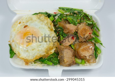 Thai packed lunch menu, Pork Belly Stir-Fried with Kale and on top with fried egg.