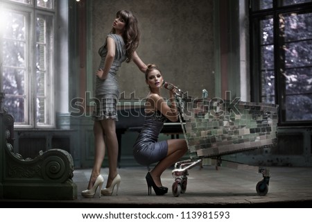 Two Sexy Women With Shopping Trolley