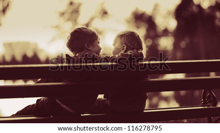 two little boys in a park two little boys in a park