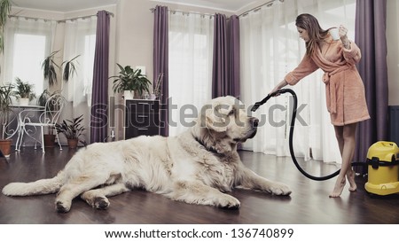 Young Woman Cleaning Big Dog