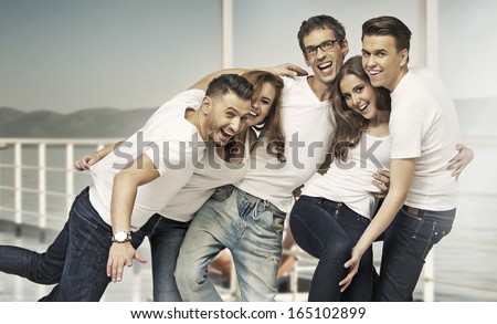 Group of happy friends presenting advert