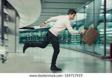 Young running businessman