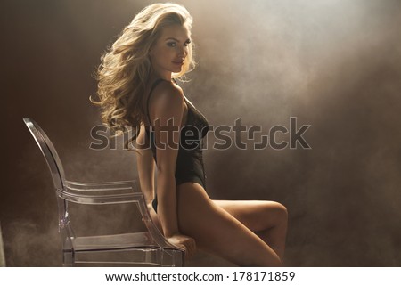 Sexy woman sitting on the crystal chair