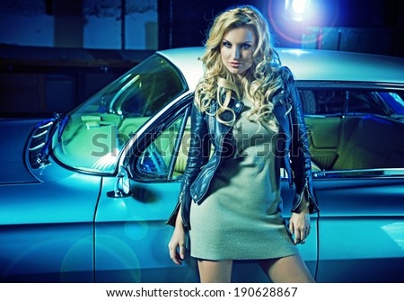 Young woman driving vintage car