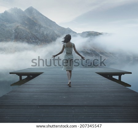 Woman on a wooden bridge
