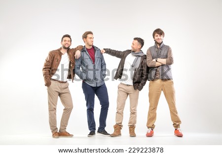 Full-length portrait of group of young men