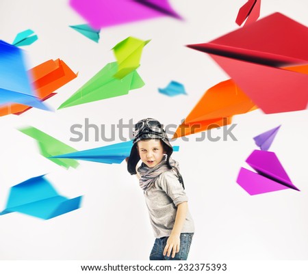 Happy kid playing with toy airplane