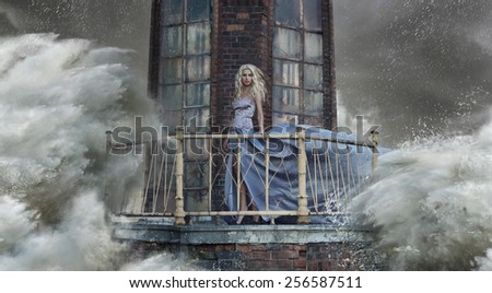 Young blonde woman on the sea storm