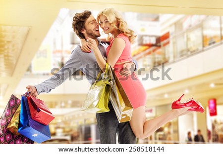 Cheerful couple on shopping trip
