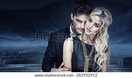 Elegant fashion couple over city background