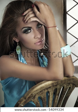 stock photo Pretty brunette posing in an vintage room