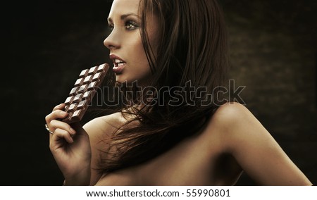 Gorgeous woman holding chocolate
