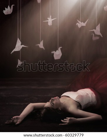 Beautiful brunette in dreamy origami - stock photo