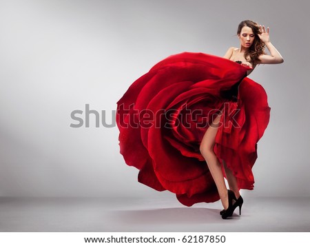 stock photo Beautiful young lady wearing red rose dress