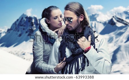 Handsome couple having fun on winter holidays