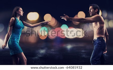 stock photo : Gorgeous couple over night city street background