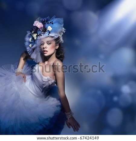 Beauty brunette in white dress - stock photo