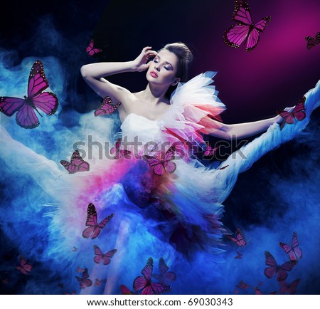 stock photo : Beauty brunette on the fog with butterflies
