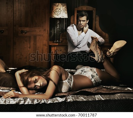 Sexy couple in bedroom - stock photo