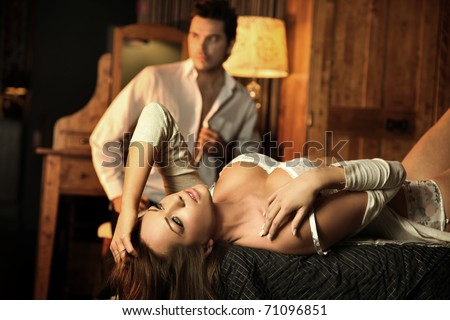 Beauty sexy woman lying on the bed - stock photo