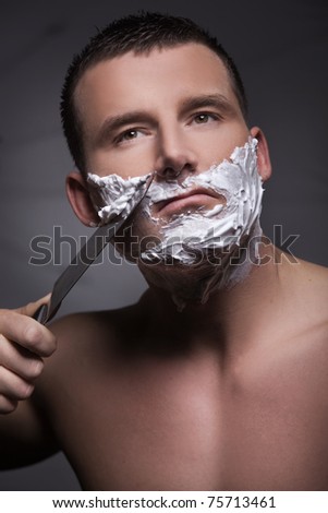 Shaving man by big knife