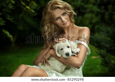 Cute young lady and a puppy dog