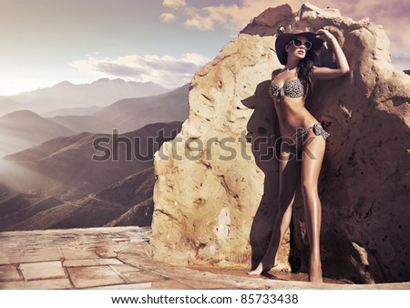 stock photo Perfect brunette wearing sunglasses and stylish hat