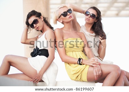 Three friends wearing sunglasses