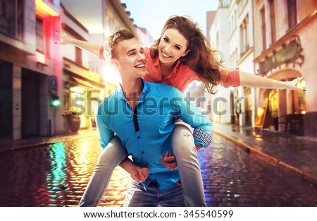 Beautiful couple having fun on a rainy day