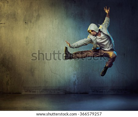Sporty hip-hop dancer jumping