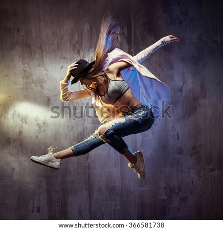 Young hip-hop dancer jumping