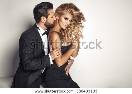 Handsome man cuddling his beloved woman