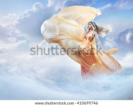 Dreamy image of a beautiful young lady in the clouds