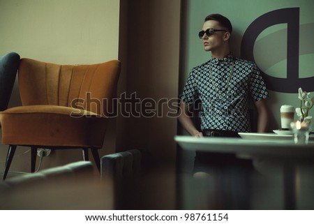 Fashionable guy in a stylish interior
