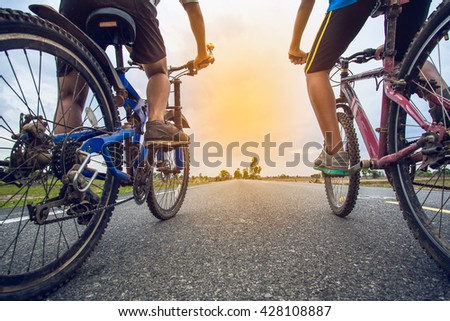 Friends cycling together