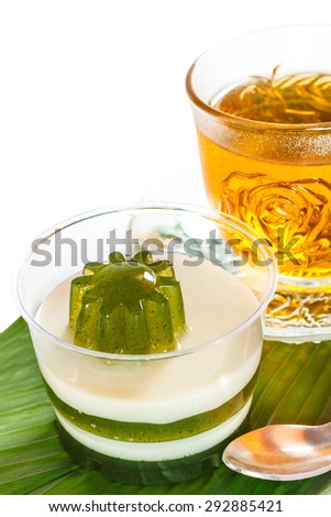 Pandan coconut and hot tea put on a green leaf. Eat to relieve hot cakes Thailand.