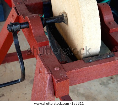 stock-photo-an-old-fashion-sandstone-grinding-wheel-153811.jpg