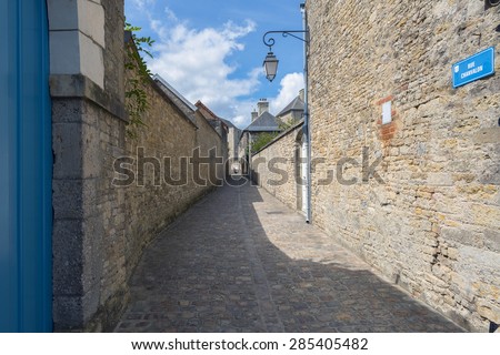 A narrow cobbled street in Carentan, Normandy, France.  The famous Easy Company of 506th PIR, 101st US Airborne saw significant action on this very street.