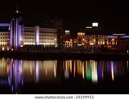 night city is reflected in water