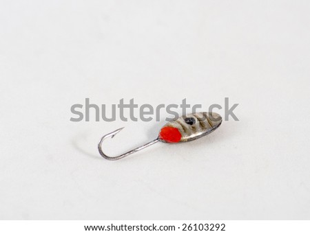 Spoon bait for winter from metal with hook on white background