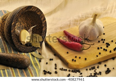 Garlic, hot chile pepper and other fragrant spices on kitchen