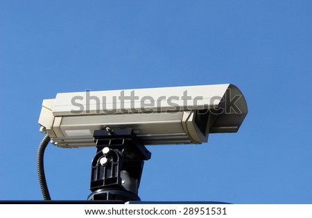 surveillance camera with a blue sky background