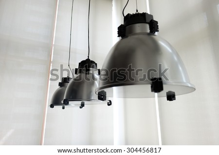 Industrial look pendant lamps over the windows