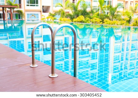 Grab bars ladder in the  swimming pool outdoor
