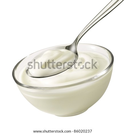 Nice product shot from a bowl and spoon with yogurt Nice product shot from a bowl and spoon with yogurt