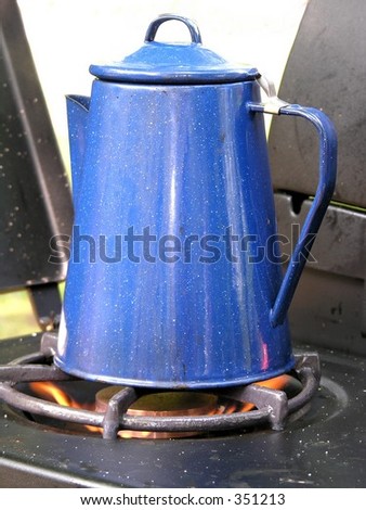 Blue coffee pot on camp stove